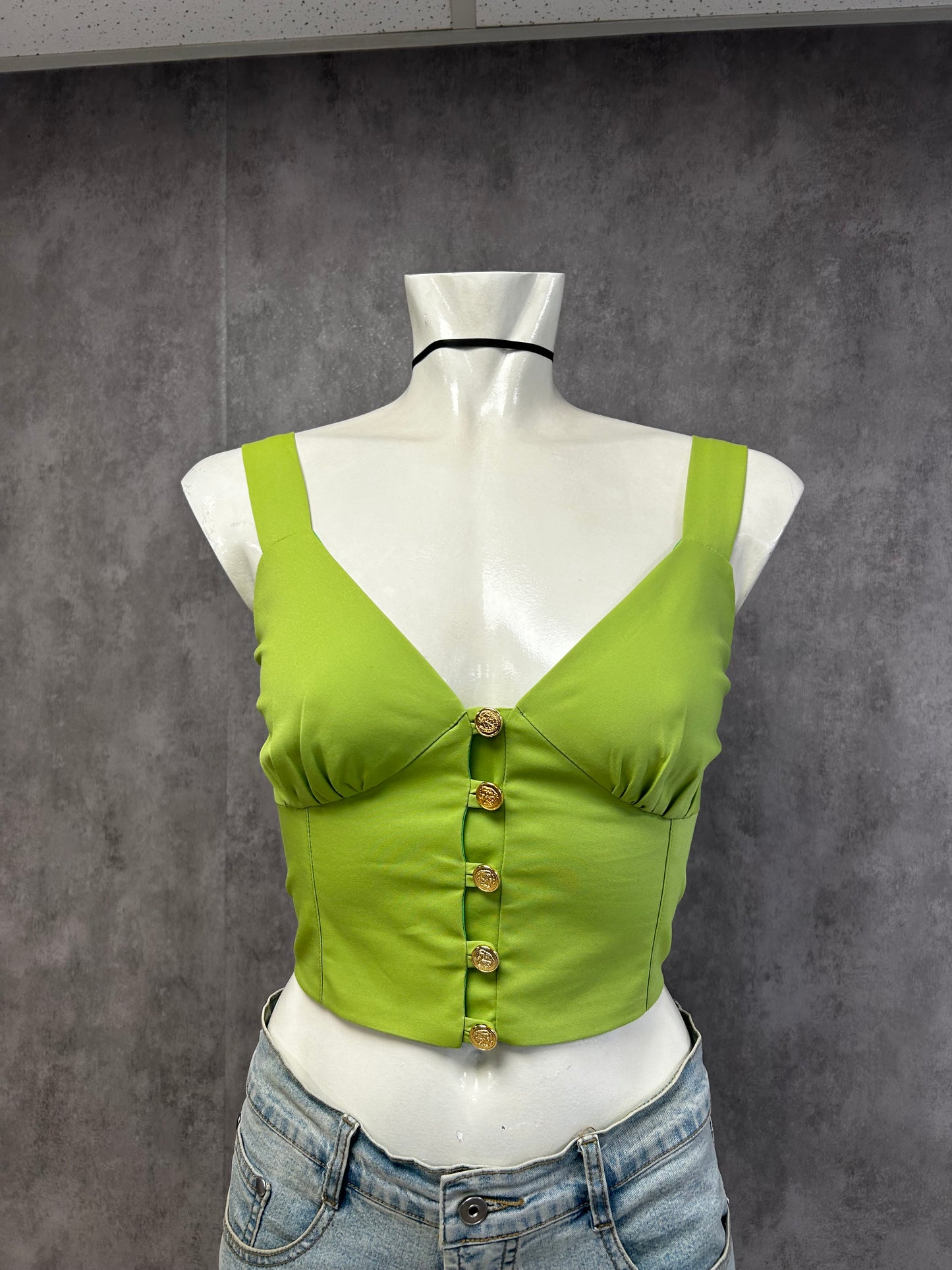 Green top with gold buttons