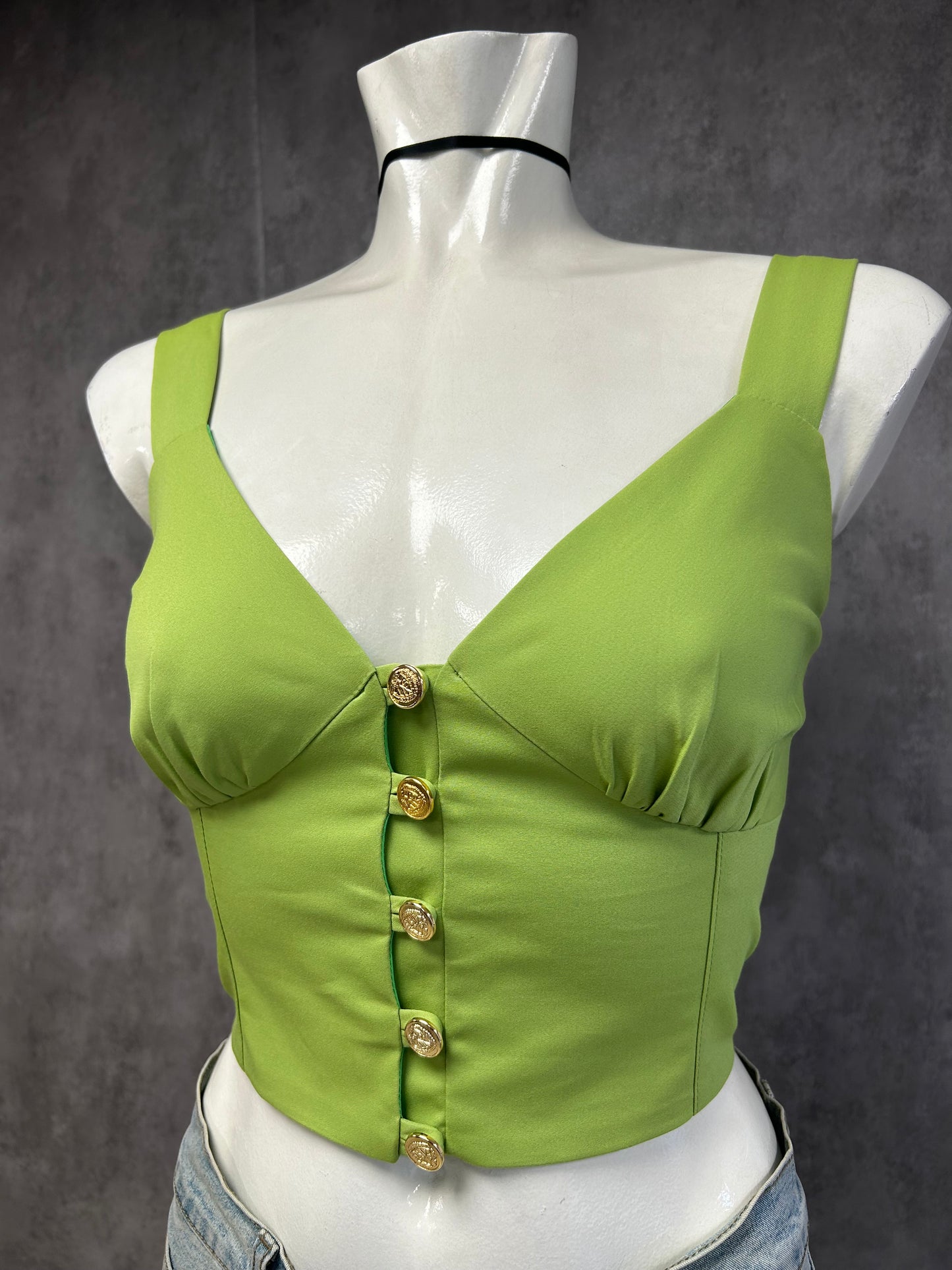Green top with gold buttons